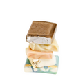 Stack of Quarter Travel Size Handcrafted Goat Milk Soap Bars by Basilwood Farm.