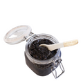 Coffee scrub in open bale jar with scoop
